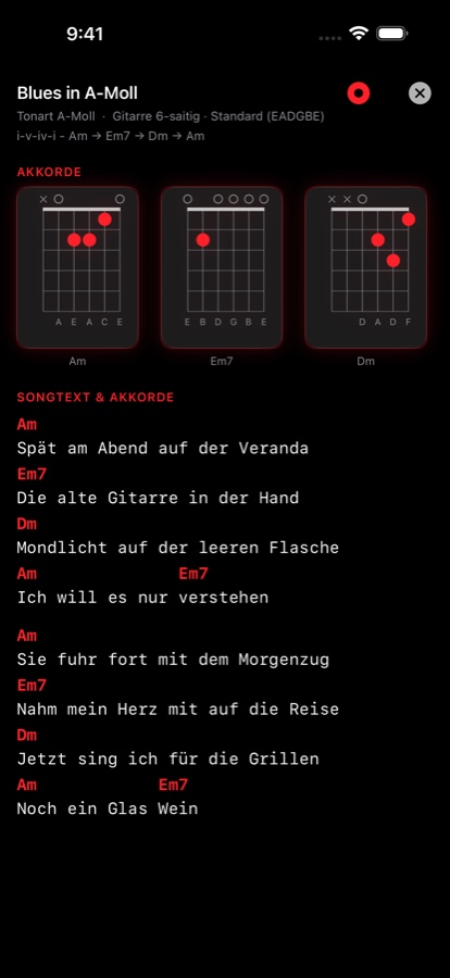 Songbook-Eintrag für einen eigenen Song namens Blues in A-Moll, mit Akkorddiagrammen oben und Songtext unter farbigen Akkordsymbolen