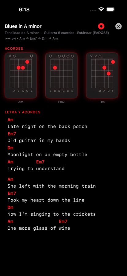 Entrada del Cancionero para un tema original llamado Blues in A minor, con diagramas de acorde arriba y la letra bajo símbolos de acorde con código de color