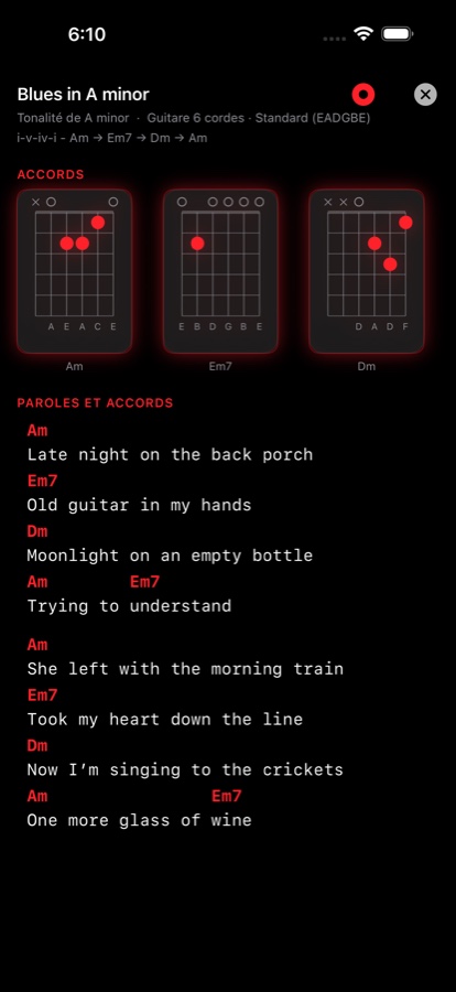 Entrée du Songbook pour un morceau original intitulé Blues in A minor, avec les diagrammes d'accords en haut et les paroles sous des chiffrages colorés